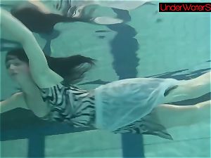 Blackhaired sweetheart Irina underwater